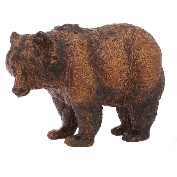 Large Jeanne Grut bear figurine.Jeanne Grut for Royal Copenhagen. Large stoneware figurine in the shape of a bear. Signed. H: 32cm. L: 43cm