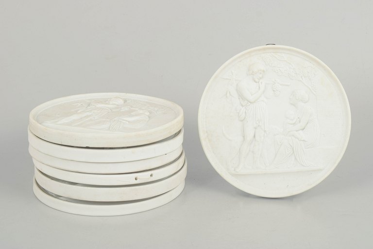 Bing & Grøndahl, set of seven biscuit wall plaques after Thorvaldsen.