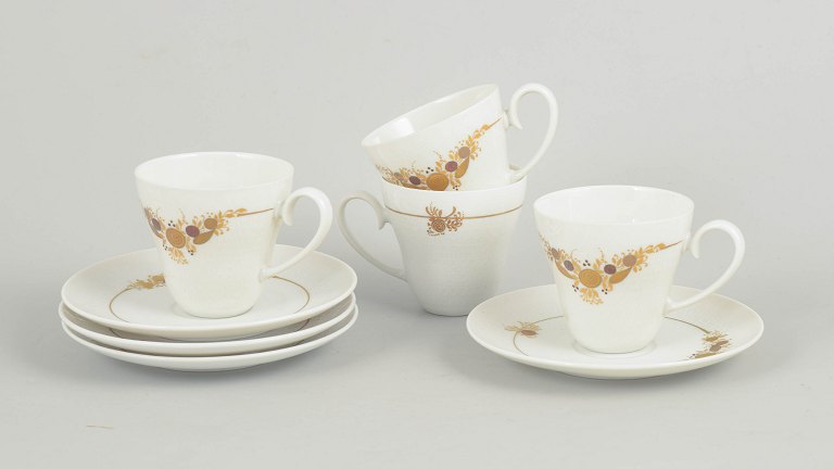 Bjørn Wiinblad for Rosenthal, set of four coffee cups with matching saucers.