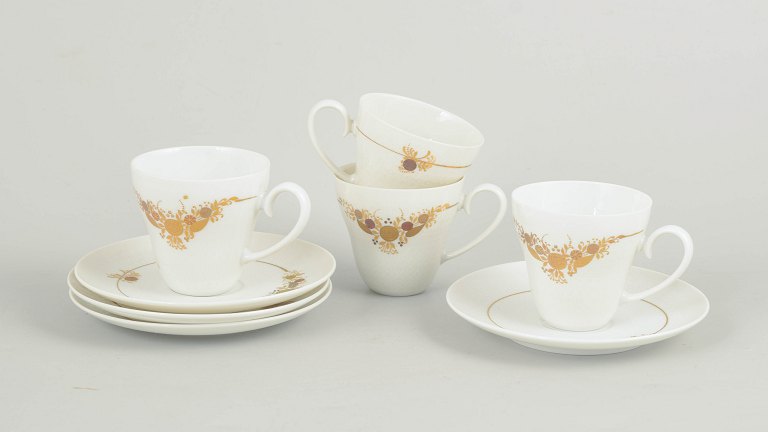 Bjørn Wiinblad for Rosenthal, set of four coffee cups with matching saucers.