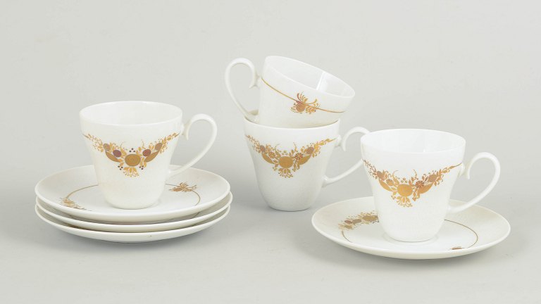 Bjørn Wiinblad for Rosenthal, set of four coffee cups with matching saucers.