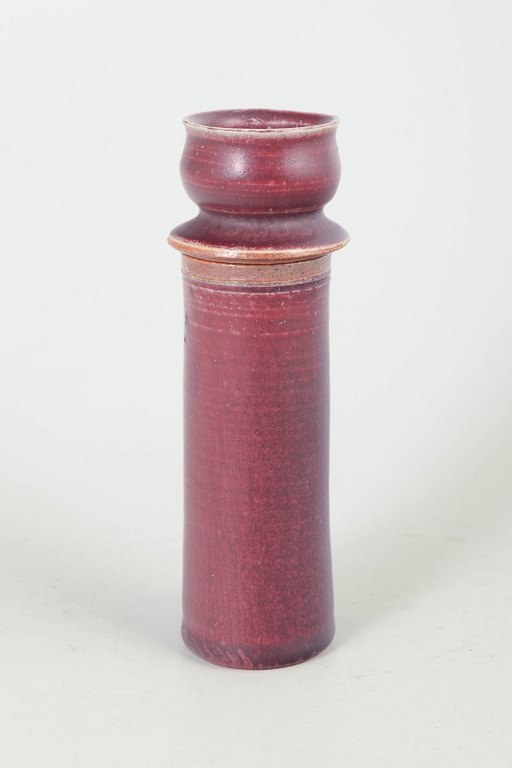 Royal Copenhagen ceramic candlestick with oxblood glaze.