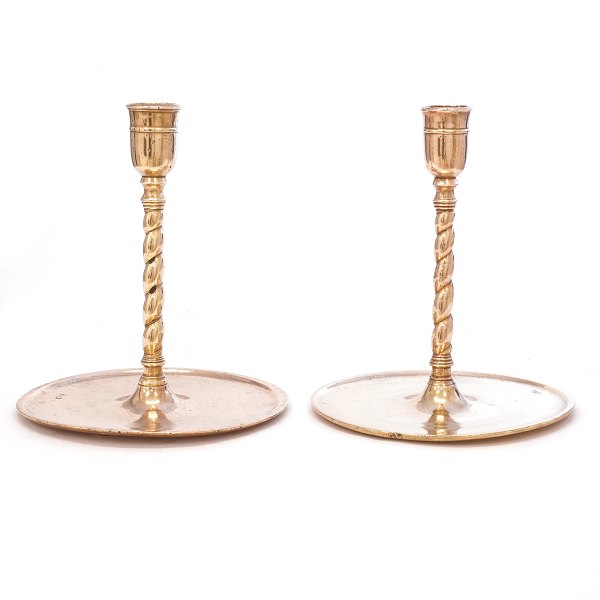 A pair of large Russian brass church candlesticks circa 1750. H: 26cm. Base diameter: 24cm