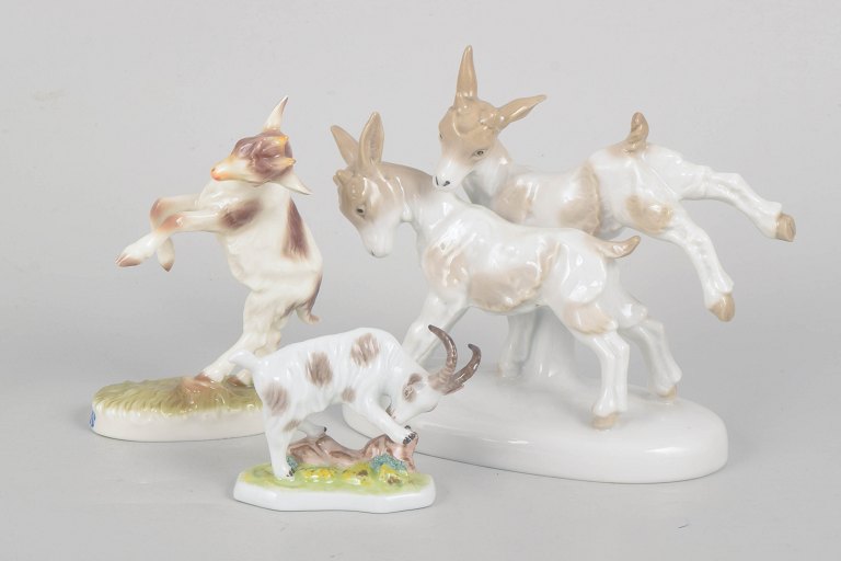 Ludwigsburg and others, set of three German hand-painted porcelain goat figurines.