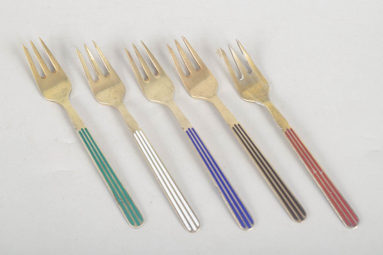 A. Michelsen, set of five cake forks in gilt sterling silver and enamel.