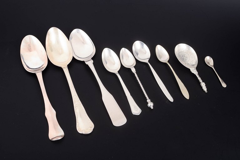 Collection of nine silver and silver-plated serving spoons.