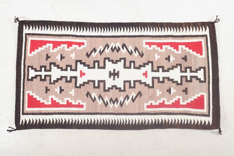 North American Navajo carpet with geometric motifs, circa 1940s.