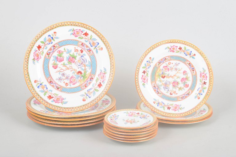 Cauldon China, "Indian tree" set of fourteen porcelain plates.