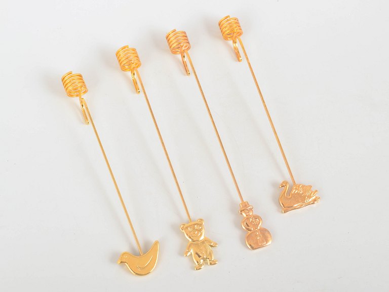 Andreas Mikkelsen for Georg Jensen, set of four Golden Christmas candleholders.