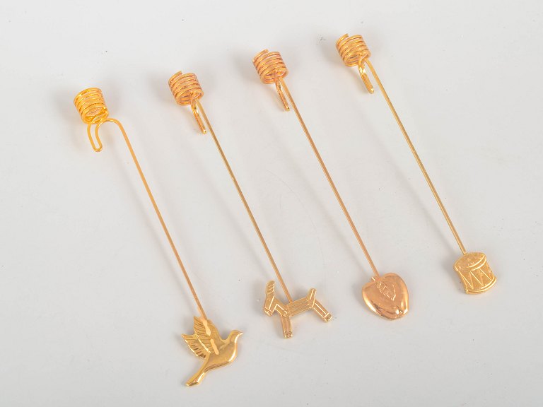 Andreas Mikkelsen for Georg Jensen, set of four Golden Christmas candleholders.