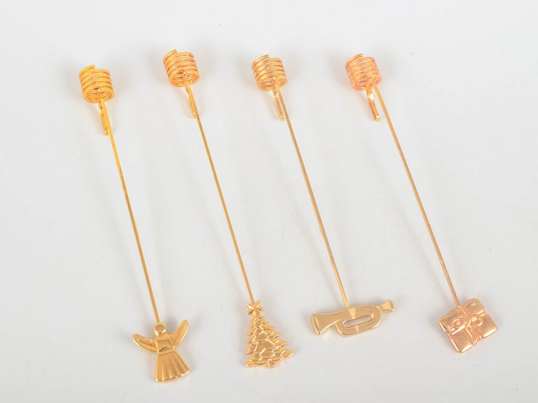 Andreas Mikkelsen for Georg Jensen, set of four Golden Christmas candleholders.