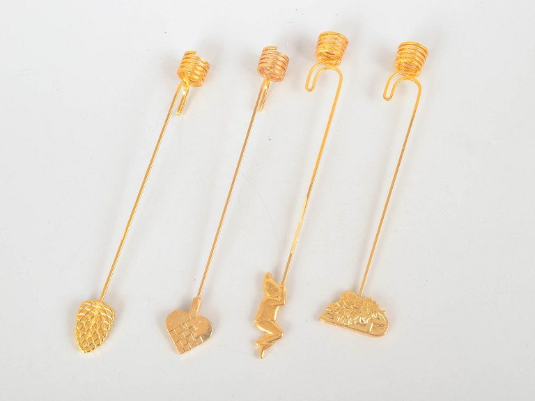 Andreas Mikkelsen for Georg Jensen, set of four Golden Christmas candleholders.