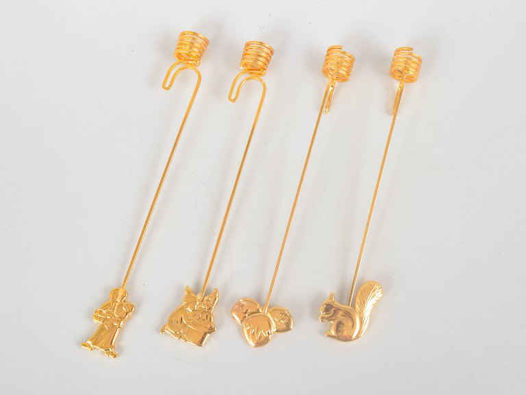 Andreas Mikkelsen for Georg Jensen, set of four Golden Christmas candleholders.