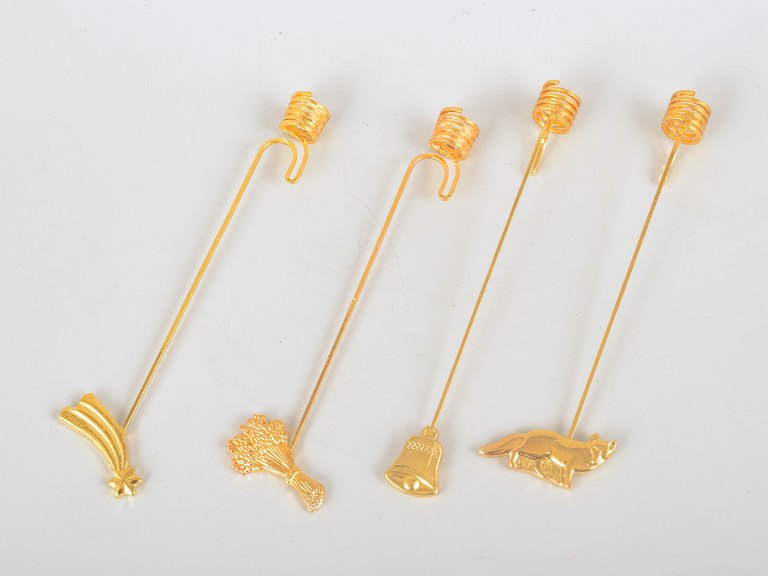 Andreas Mikkelsen for Georg Jensen, set of four Golden Christmas candleholders.