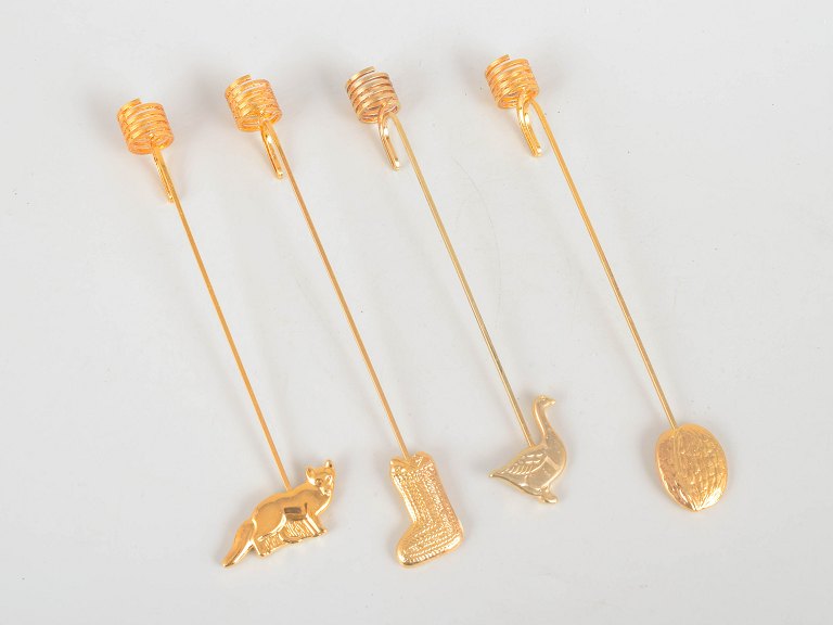 Andreas Mikkelsen for Georg Jensen, set of four Golden Christmas candleholders.