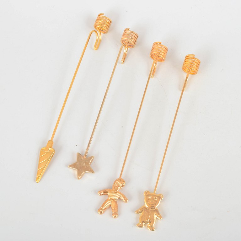 Andreas Mikkelsen for Georg Jensen, set of four Golden Christmas candleholders.